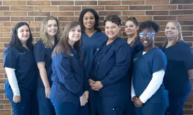 Nursing Student in Stethoscope Smiling in Nashville Nursing School Simulation Lab